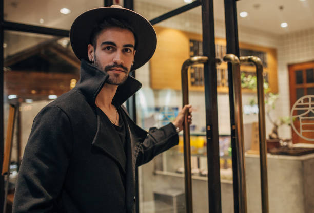 istock Hipster man opening the door 1171086995