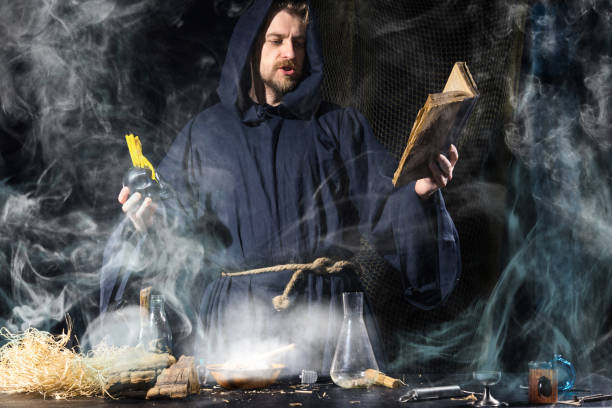 istock The medieval alchemist make magic ritual at the table in his smoke laboratory. 1171087226