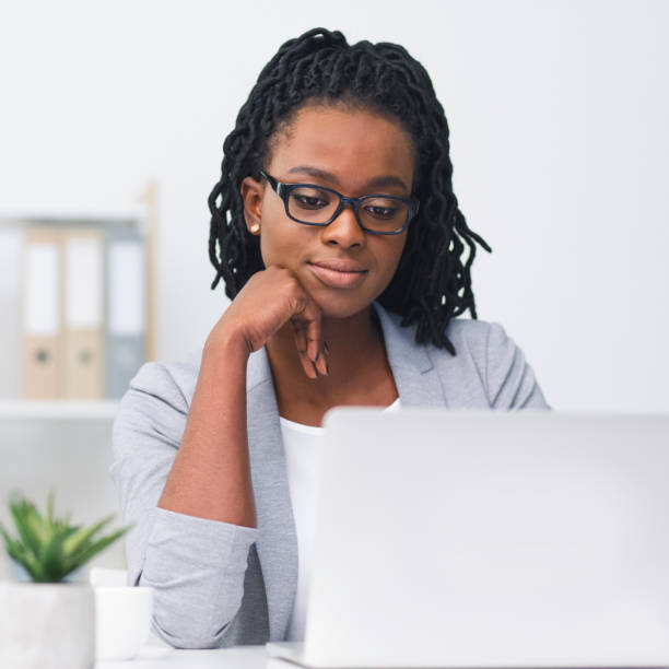 istock Afro Business Lady Using Laptop In Modern Office 1171088375