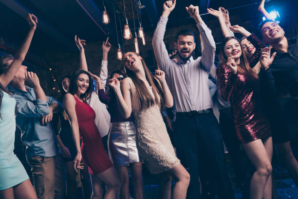 istock Party hard stay all nigh concept. Buddies dancing having fun active dynamic discotheque raise hands feel content dress shirt trousers suit formal wear indoors 1171088781