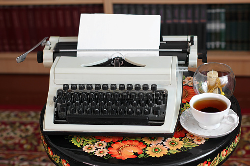 Typewriter, tea. Old things. Workplace