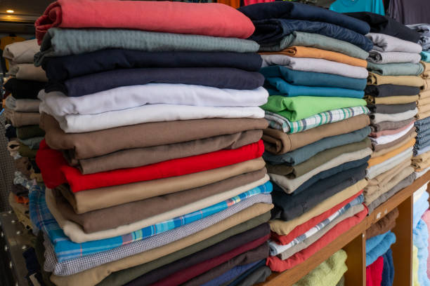 istock Clothes that are arranged on shelves and hangers. 1171089802