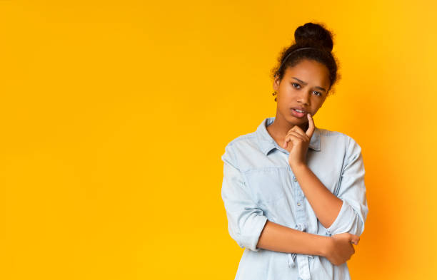 istock Sceptical teen looking suspiciously to camera, having some doubts 1171090044