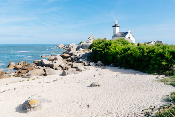 istock Scenic view of beach and lighthouse in Brittany 1171091268