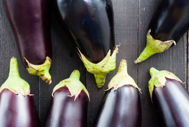 istock Eggplants on black wooden 1171091552