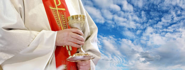 istock Priest with chalice celebrate mass and empty place for text 1171091870