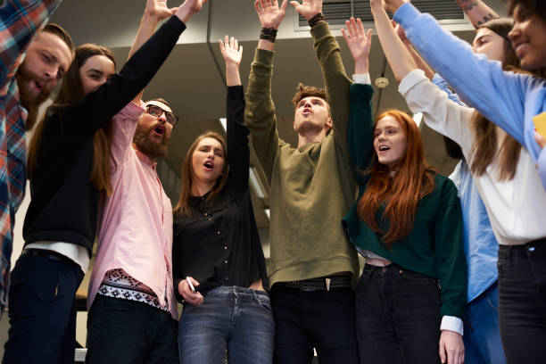 istock Positive international group of talented students emotionally celebrating successfully passed examination in university.Prosperous professionals IT developers having fun after work day in office 1171092530