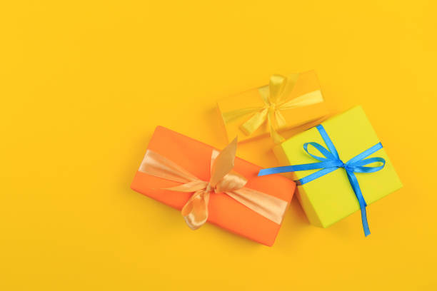 istock Different colored gift box on color background. Top view of various present boxes on minimal background. Birthday, Christmas, wedding, valentine, romantic gifts 1171092933