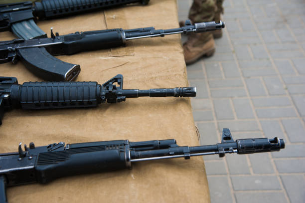 istock Machine guns with ammunition on the table 1171094181