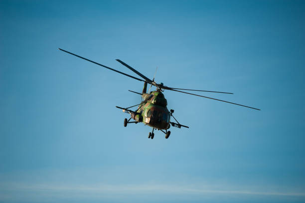 istock Military helicopter flying during exercise 1171094619