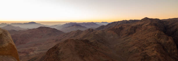 istock Beautiful view from the mountain. Panorama. Mountain range with visible silhouettes through the morning blue fog 1171094714