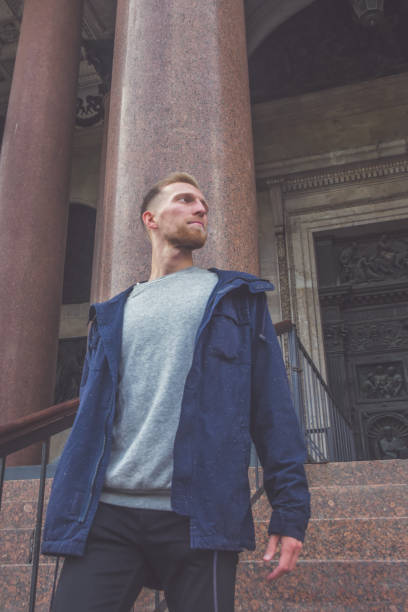 istock bearded young man outdoors next to stone pillars 1171100757