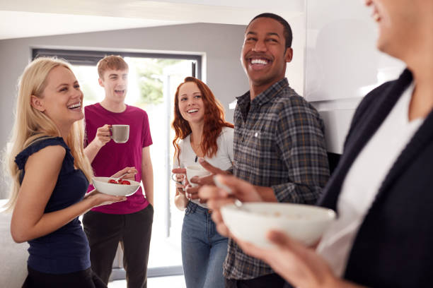 istock Group Of College Students In Shared House Kitchen Eating Breakfast Together 1171101599