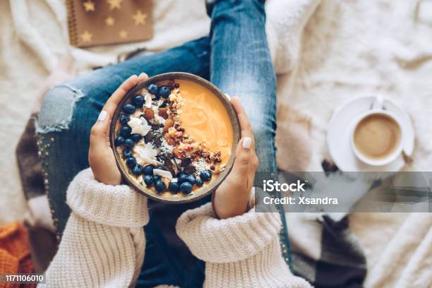 Woman Holding A Pumpkin Smoothie Bowl Stock Photo - Download Image Now - Bowl, Breakfast, Smoothie
