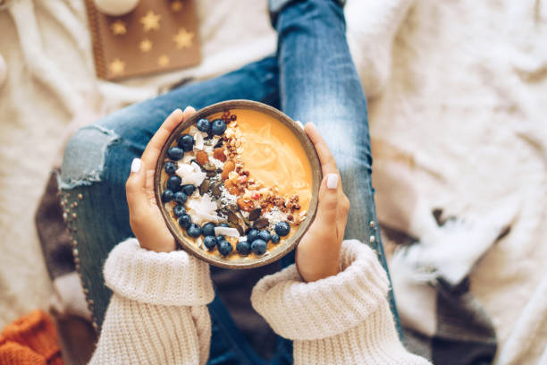 istock Woman holding a pumpkin pie smoothie bowl 1171106808