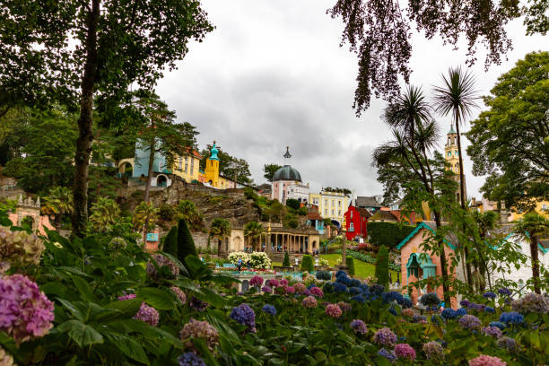 View of Portmeirion Village through trees View of Portmeirion Village through trees portmeirion stock pictures, royalty-free photos & images
