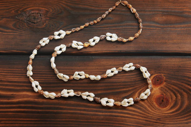 istock Seashell necklace on wooden background 1171109737