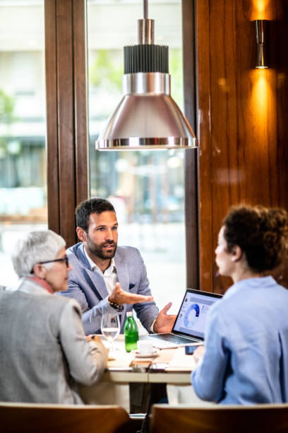istock Two female co-investors analyzing a pie chart on a laptop with a colleague 1171109910