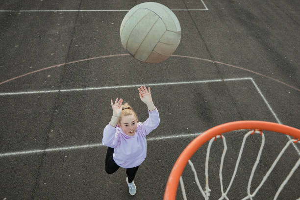 istock Teenage Girl Playing Netball 1171114134