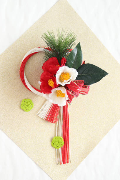 istock camellia bouquet and mizuhiki wreath 1171118178