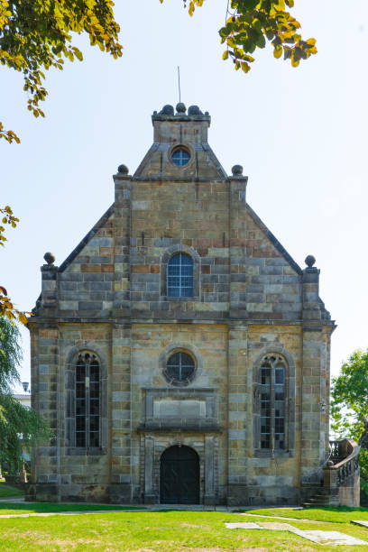 istock Church in Bad Bentheim, Germany, with grass field. 1171118836