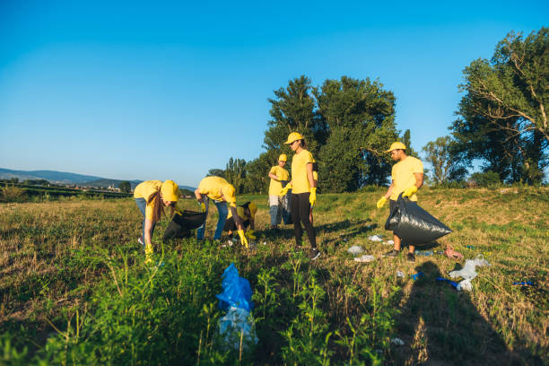 istock People cleaning up garbage in nature 1171119922