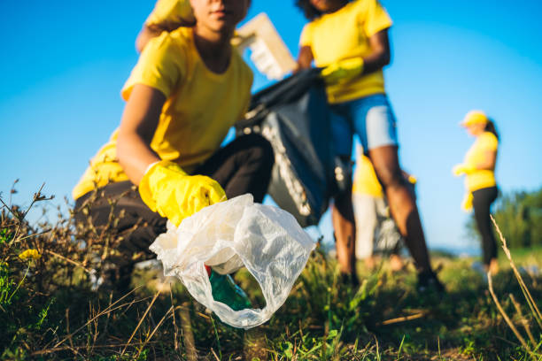 istock People cleaning up garbage in nature 1171119943