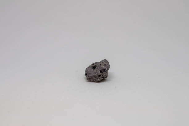 istock basalt mineral from Italy with white background 1171120235