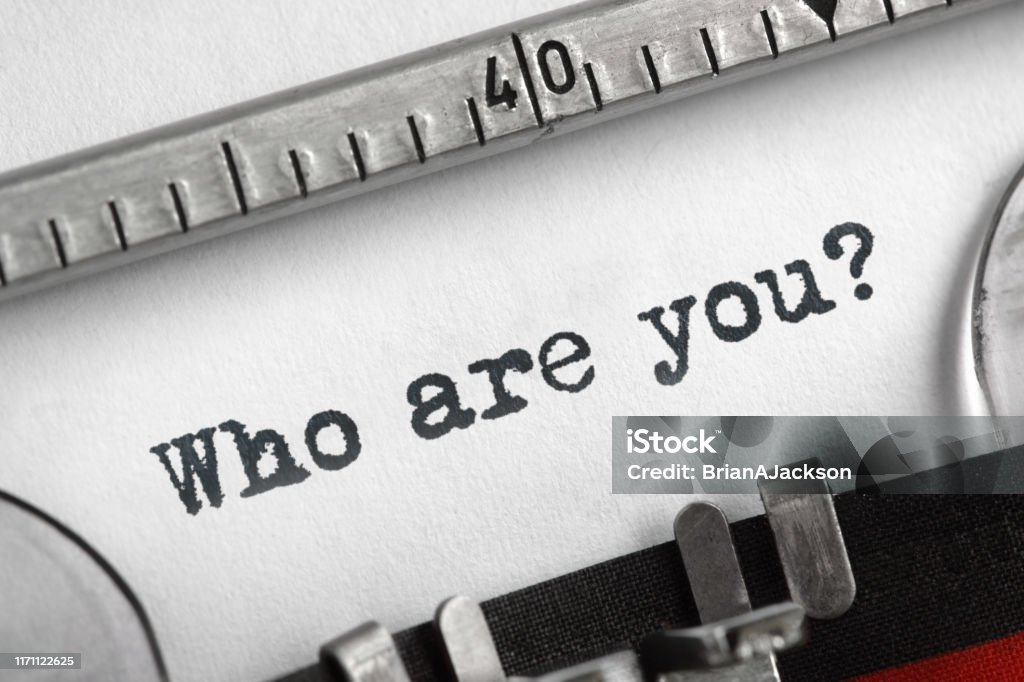 Who are you typed on an old typewriter Who are you typed on an old typewriter concept for self belief, positive attitude and  identity Individuality Stock Photo