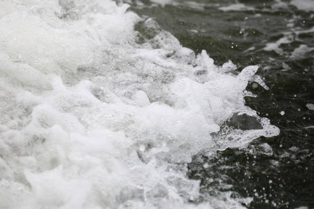 istock blurred and Double bokeh sponge and tsunami is blowing to the shore 1171122890