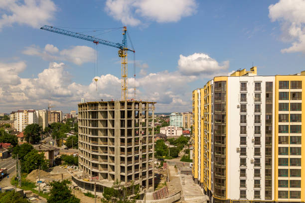 istock Apartment or office tall concrete building under construction. 1171124694