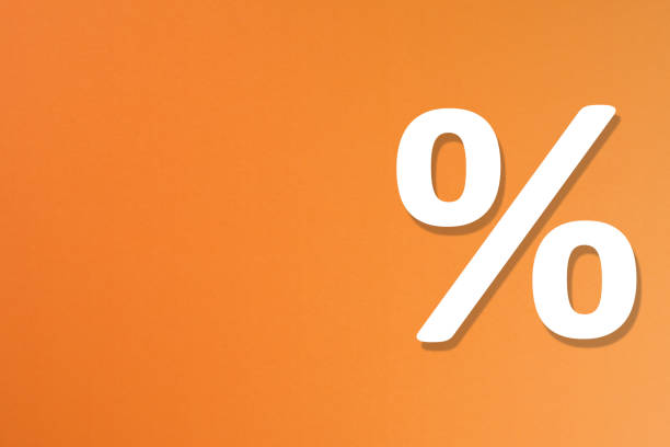 istock Percentage sign on orange background with copy space 1171127363
