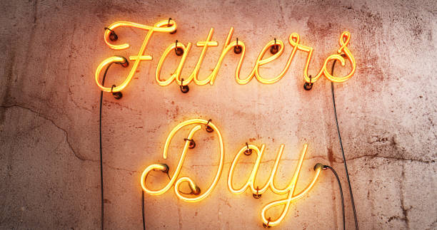 istock Fathers day red neon sign on a concrete grunge wall. 1171127629