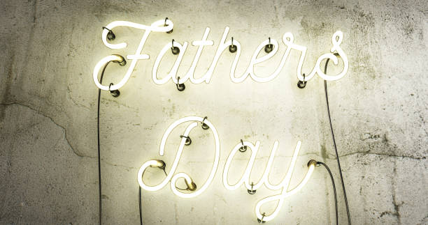 istock Fathers day white neon sign on a concrete grunge wall. 1171128484