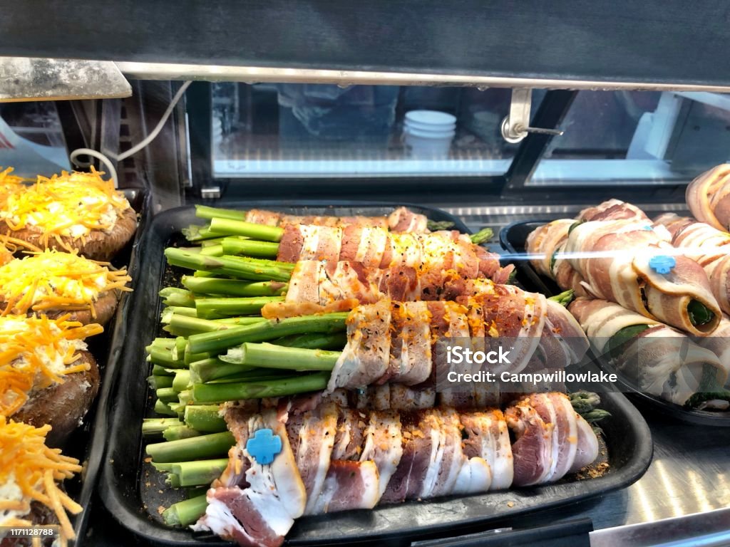 Bacon wrapped asparagus in a diplay case American Culture Stock Photo