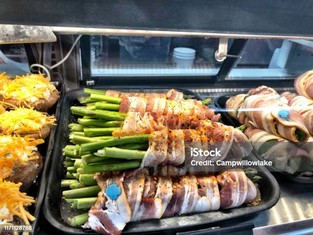 Bacon Wrapped Asparagus In A Diplay Case Stock Photo - Download Image Now - American Culture, Appetizer, Asparagus