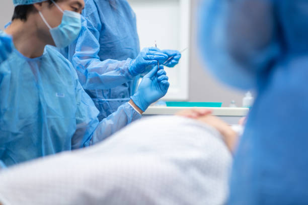 istock Pregnant woman lays on operating table before receiving cesarean section 1171128914