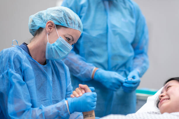 istock Doctor holding patient's hand before surgery 1171128959