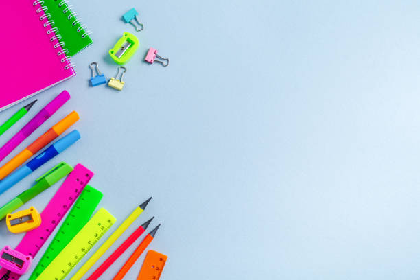 istock Notebook, colored pencils, ruler, pen, eraser, sharpener and more. School and office stationery on blue background. Concept back to school. Top view. 1171130755