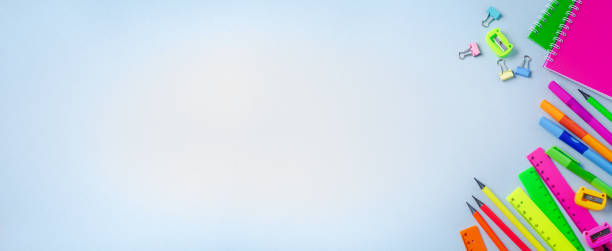 istock Notebook, colored pencils, ruler, pen, eraser, sharpener and more. School and office stationery on blue background. Banner Concept back to school. Top view. 1171130815