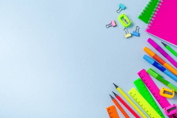 istock Notebook, colored pencils, ruler, pen, eraser, sharpener and more. School and office stationery on blue background. Concept back to school. Top view. 1171130965
