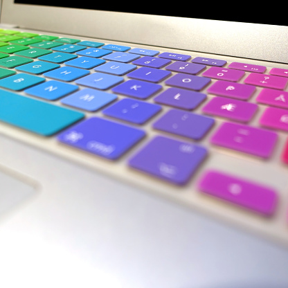 LGBT community Rainbow Pride signature colours on a laptop computer.