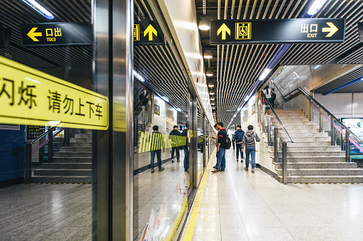 Shanghai, China - April 20, 2018: passengers on platform of a shanghai subway station