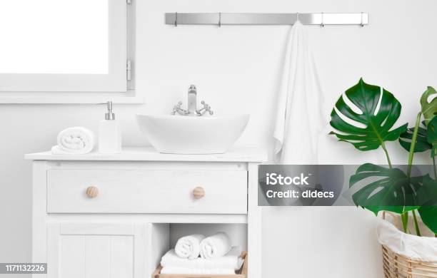 Simple Bathroom Cabinet With Various Supplies Storage And Organizing Concept Stock Photo - Download Image Now