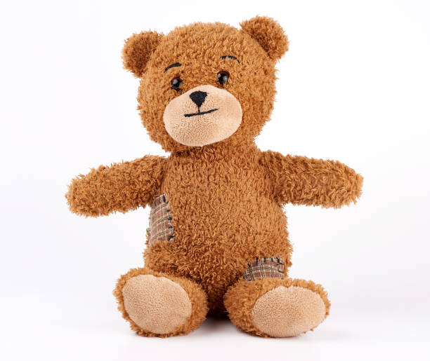 istock brown vintage teddy bear with patches 1171133233