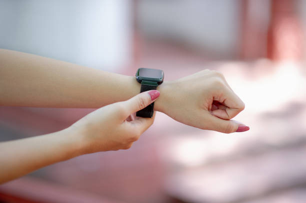 istock His hands and black wristwatch Knowing the time, concept, time 1171133434