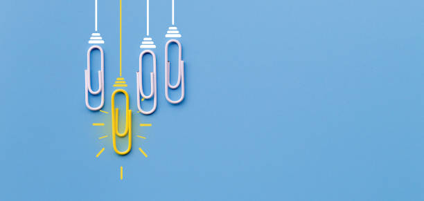 Great ideas concept with paperclip,thinking,creativity,light bulb on blue background,new ideas concept.