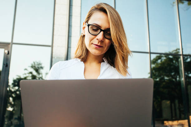 istock Young busines woman with notebook 1171134627