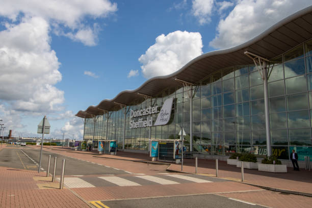 Doncaster UK, 18th August 2019: The Doncaster Sheffield Robin Hood international airport, outside the front entrance taken on a part cloudy sunny day. in West Yorkshire Doncaster UK, 18th August 2019: The Doncaster Sheffield Robin Hood international airport, outside the front entrance taken on a part cloudy sunny day. in West Yorkshire doncaster photos stock pictures, royalty-free photos & images