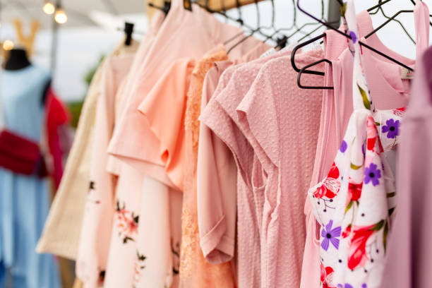 istock Racks with clothes outdoors. Designer sells clothes at a city fair 1171136627